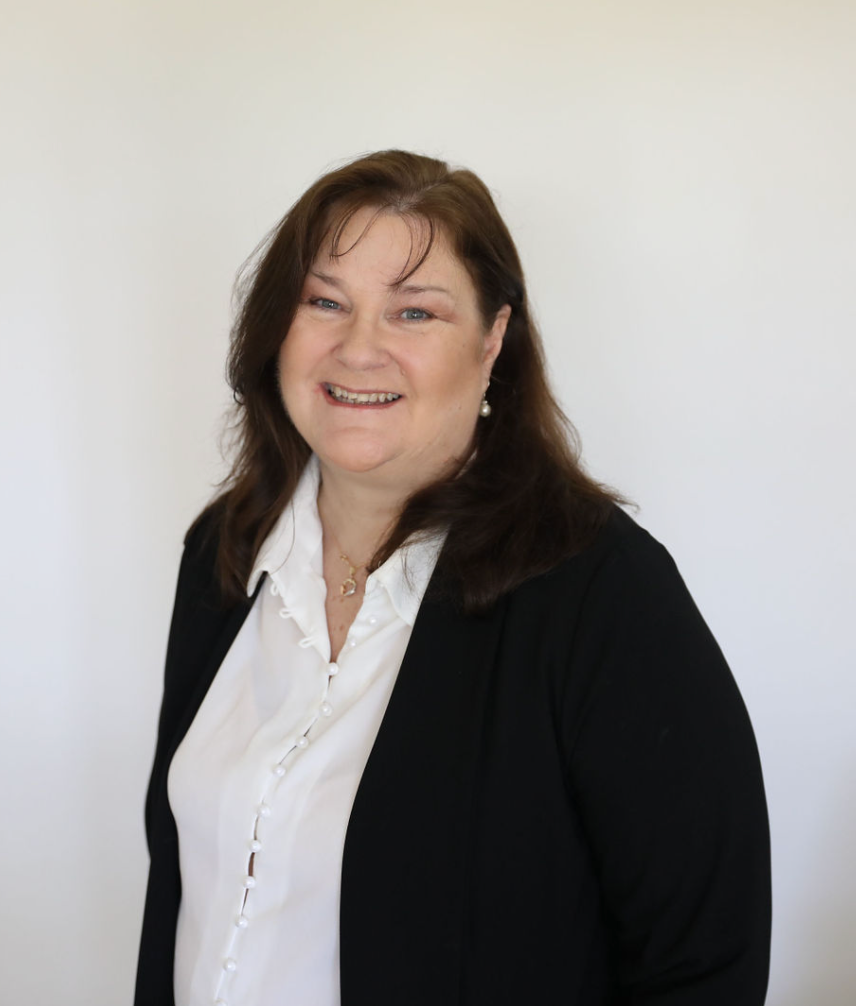 Carrie Wallis, marketing mentor and empowerment coach, smiling warmly